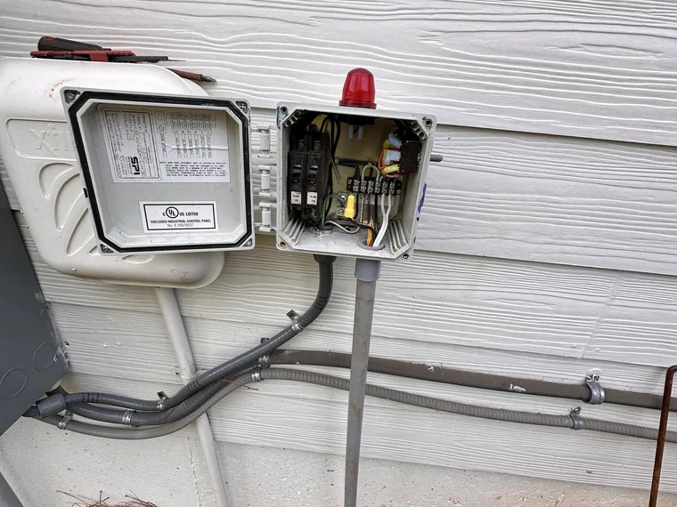 Septic pump control and alarm panel opened for service by SepticRooter™ in Talking Rock, Pickens County