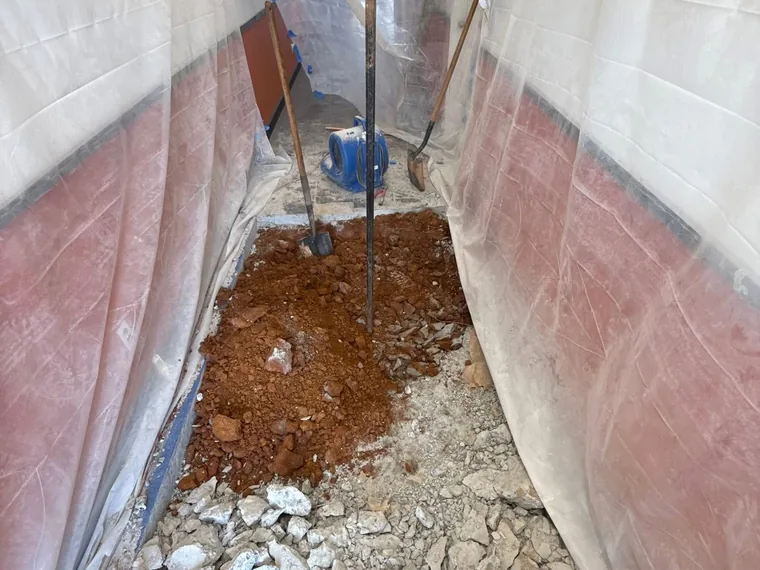 Interior slab demolition with a Makita breaker during a commercial grease trap job