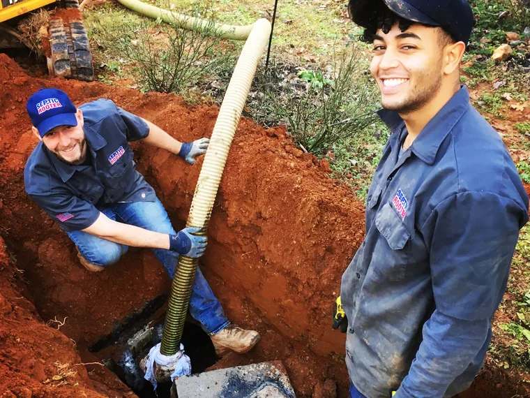 SepticRooter crew working in a trench on a Rex septic job